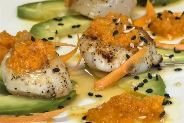 Seared scallops with avocado and carrot-ginger sauce